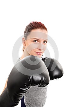 Smiling beautiful young girl with boxing gloves