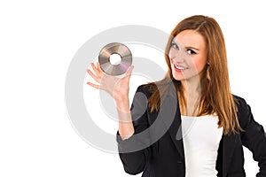 Smiling beautiful young woman holding DVD.