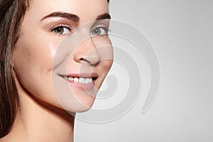 Smiling Beauty Woman Face Portrait. Beautiful Spa Model Girl with Perfect Fresh Clean Skin. Youth and Skin Care Concept