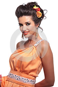 Smiling beauty woman with nice makeup and flowers in her hair