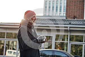 Smiling beggar at street ask for money photo