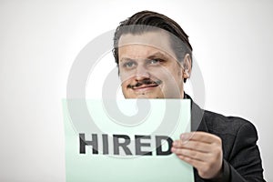 Smiling when being hired