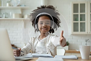 Smiling biracial little girl recommend online course