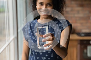 Smiling biracial woman recommend drinking clean water