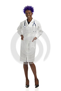 Smiling Black Female Doctor Is Standing With Hand In Pocket. Front View, Full Length, Isolated