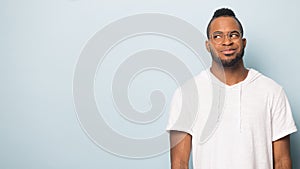 Smiling black male look at copy space consider offer
