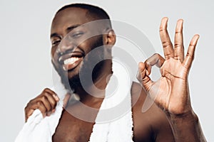 Smiling black man with white towel