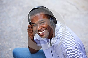 Smiling black teen with headphones