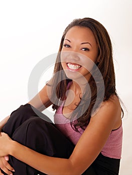 Smiling black woman with braces on upper teeth