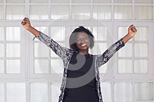 Smiling black woman with confidence pose