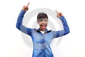 Smiling black woman pointing fingers up