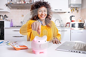Smiling black woman saving goal for future retirement plan looking at the camera