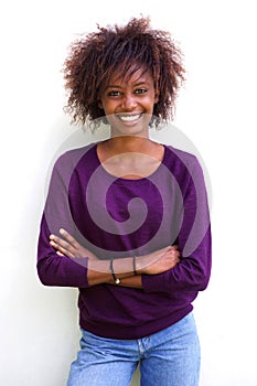 Smiling black woman standing against white background