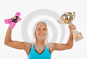 Smiling blond athlete with champion cup.