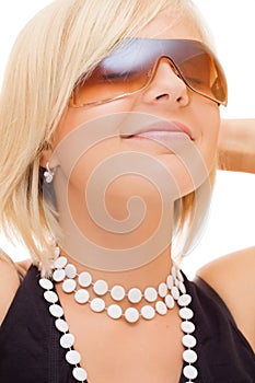 Smiling blond girl in sun glasses