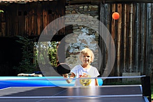 Little girl playing ping-pong