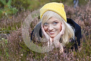 Smiling blond teen woman on the moor