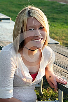 Smiling Blond Woman At Outdoor Table 2