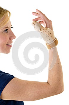 Smiling Blond Woman Wearing Supportive Thumb Brace