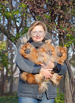 Smiling blonde woman middle aged with her dogs