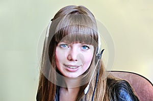 Smiling blue-eyed girl operator