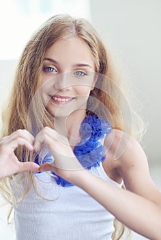 Smiling blue eyes female teenager portrait.