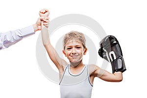 Smiling boxing champion child boy gesturing for victory triumph photo