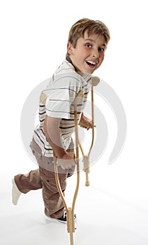 Smiling boy on crutches
