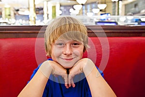 Smiling boy in a diners