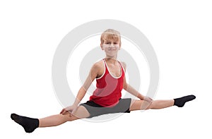 Smiling boy doing horizontal splits