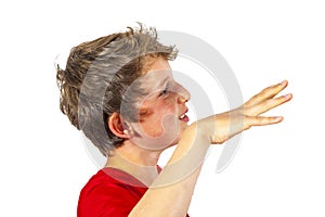 Smiling boy gesticulates isolated on white
