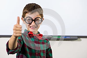 Smiling boy gesturing thumbs up sign