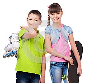Smiling boy and girl with skate and rollers