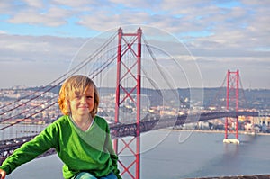 Smiling boy at the Golgen Gate bridge, Lisbon