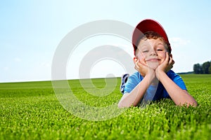 Smiling boy in grass