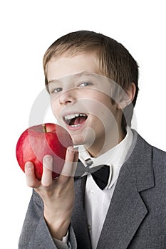 Smiling boy holding an apple