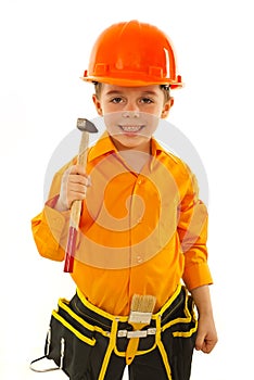 Smiling boy holding hammer