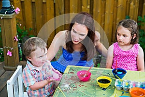 Smiling Boy Holds his New Dyed Pink Easter Egg