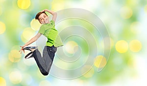 Smiling boy jumping in air