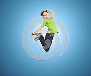 Smiling boy jumping in air
