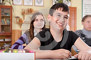 Smiling boy during lesson at school