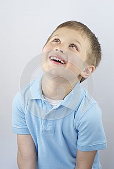 Smiling Boy Looking Up photo