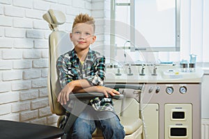 Smiling boy in Otolaryngologist cabinet at clinic