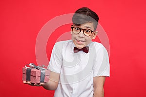 Smiling boy posing with giftbox