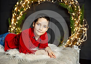 Smiling boy ready for celebrate Xmas event. Cute kid having fun