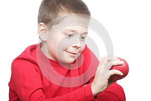 Smiling boy with red apple