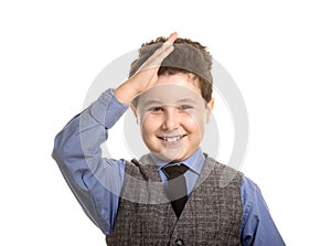 Smiling boy saluting like soldiers