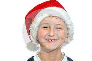 Smiling boy in Santa red hat