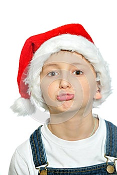 Smiling boy in Santa red hat