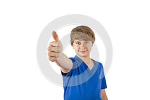 A smiling boy is showing his thumbs up sign